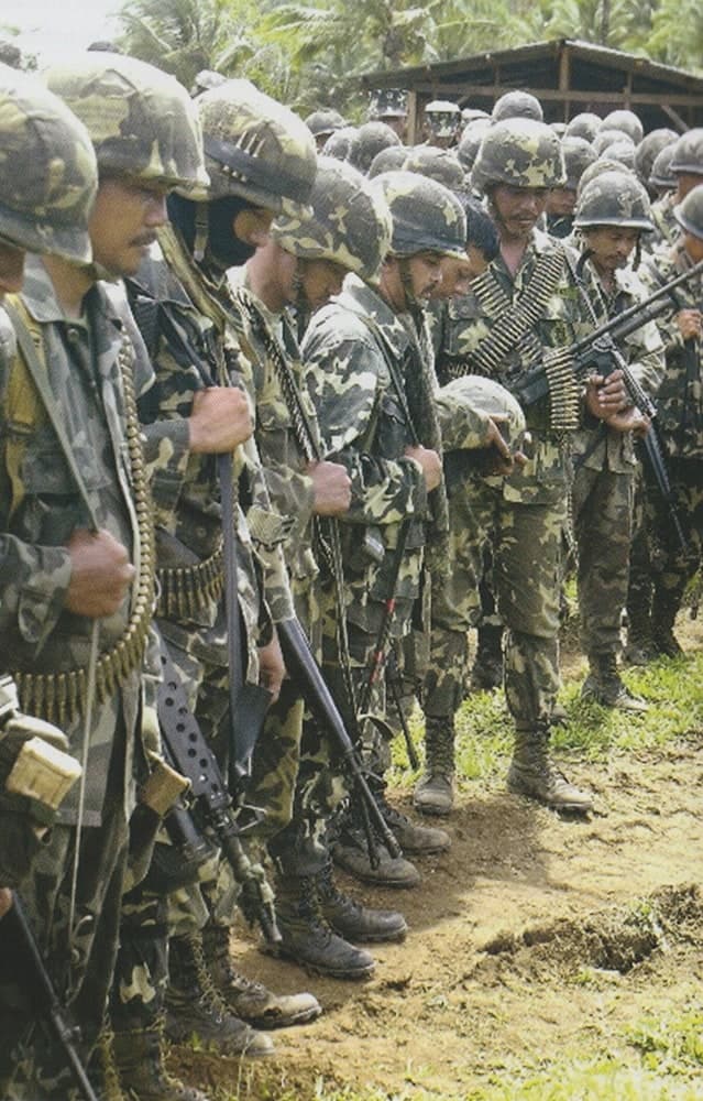 Marines pray prior the start of military operations during Central Mindanao campaign